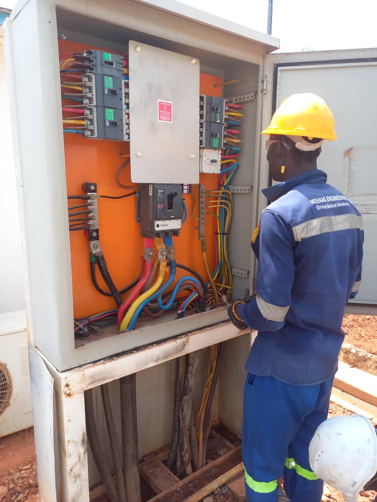 Technician terminating an outdoor distribution panel